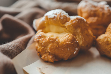 Freshly baked choux pastries close up.