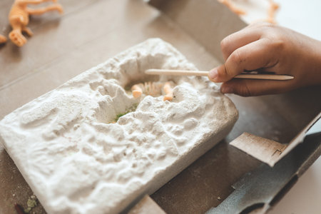 An interesting activity for children: excavating dinosaurs,.