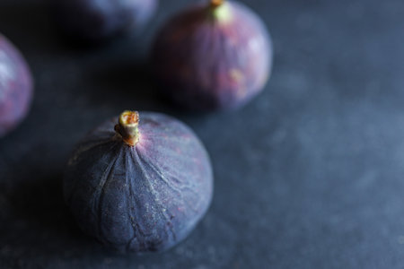 fresh ripe figs on dark background, top viewの写真素材