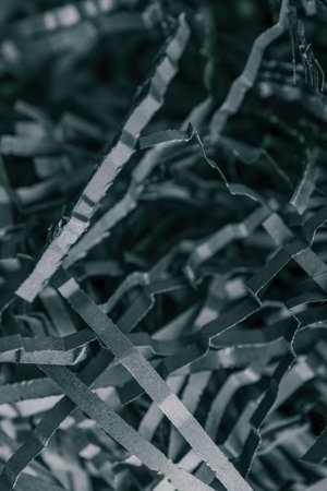 black color shredded paper. Box filler background.
