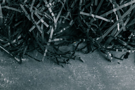 black color shredded paper. Gift box filler background.の写真素材