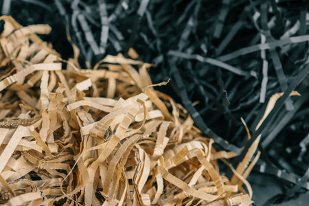 Beige and black color shredded paper. Box filler background.の写真素材