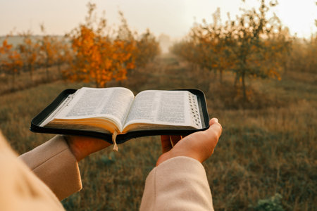Girl with a Bible in her hands, Christian concept.の写真素材