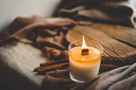 Burning candle in home interior, autumn aesthetics.の写真素材