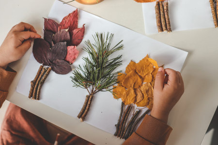 Children's creativity, child's study of natural materials, application top view.