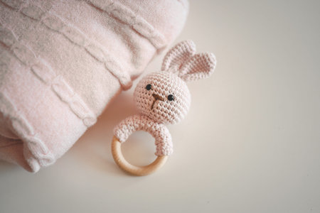 Handmade knitted rattle and baby pink blanket.の写真素材