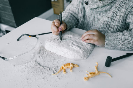 An interesting activity for children: excavating dinosaurs,.