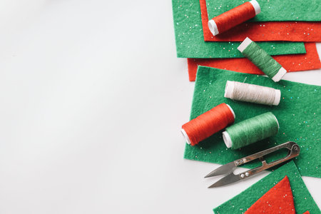 Composition with threads and sewing accessories on white background.の写真素材