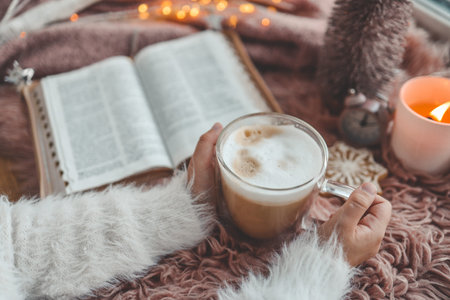 Cup of coffee and open Bible, winter morning mood.