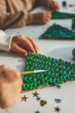 Child coloring pasta creativity, Christmas activity idea.の写真素材