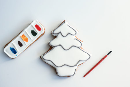 Gingerbread in the shape of a Christmas tree for coloring yourself, an idea for creativity with children.の写真素材