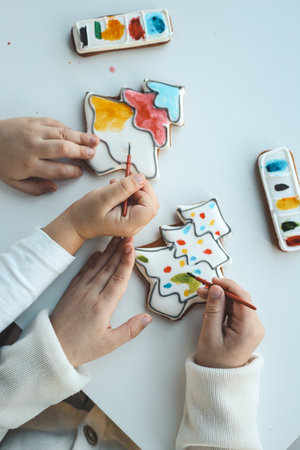 Children coloring gingerbread, creative idea.の写真素材