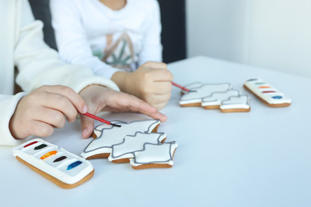 Children coloring gingerbread, creative idea.の写真素材