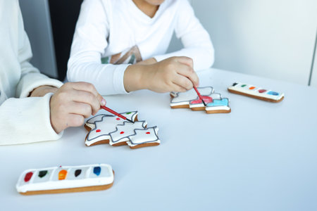 Children coloring gingerbread, creative idea.の写真素材