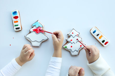 Children coloring gingerbread, creative idea.の写真素材