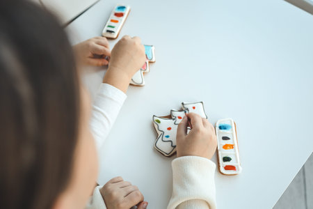 Children coloring gingerbread, creative idea.