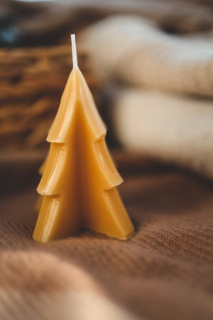 Beeswax Christmas tree candle, cozy photo.の写真素材
