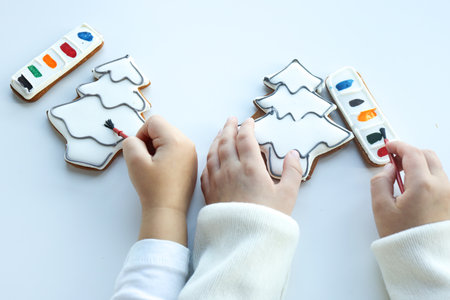 Children coloring gingerbread, creative idea.の写真素材