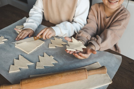 Child making pizza in the shape of a Christmas tree, activity idea.