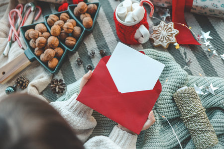 Letter to Santa in the hands of a child.