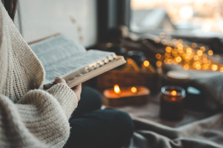 Girl with a Bible in her hands in a cozy home interior, concept of prayer and worship.
