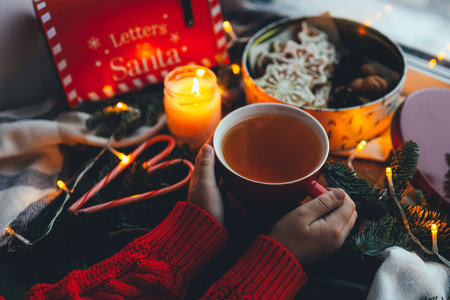 A cup of tea with smoke in a Christmas atmosphere, mood.の写真素材