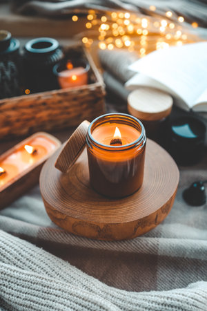 Burning candle in a festive cozy interior.の写真素材