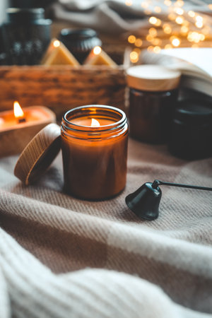 Burning candle in a festive cozy interior.の写真素材