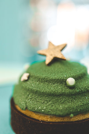 Christmas dessert in a cafe, cake in the shape of a Christmas tree.