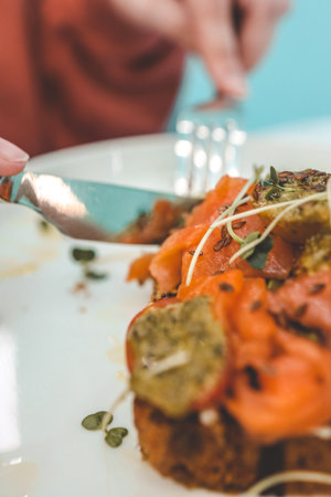 Girl in a cafe eating.の写真素材