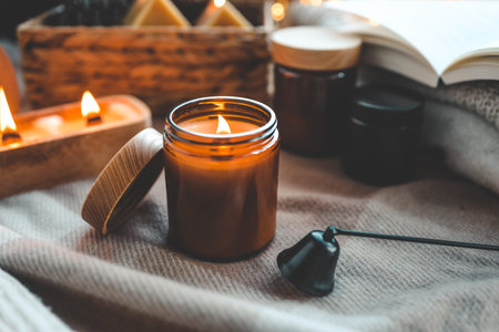 Burning candle in a festive cozy interior.の写真素材