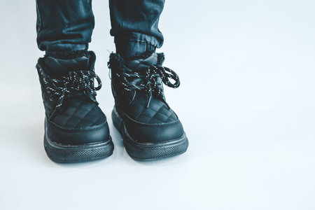 Stylish fashionable black children's shoes, close-up.