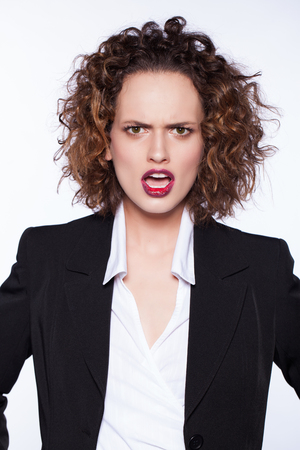 angry beautiful young woman shoutingの写真素材