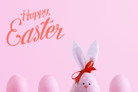 Handmade rabbit among Easter eggs, the concept of celebration and fun.の写真素材