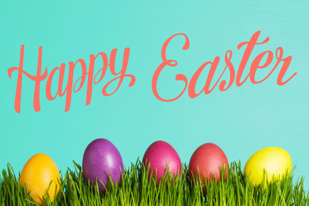 colored Easter eggs on the grass