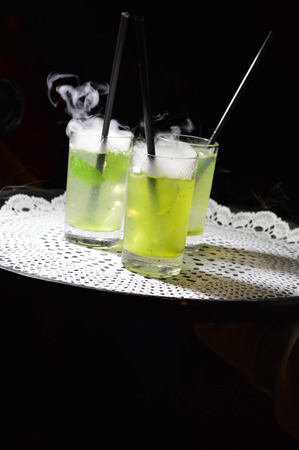 Green drinks with smoke on topの写真素材