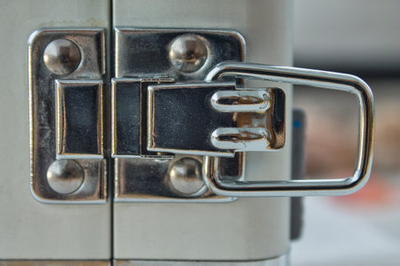 Close-up of a locked metal briefcase, safeguarding valuable assets, corporate data, and confidential information.の写真素材