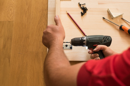 Cordless screwdriver usingの写真素材