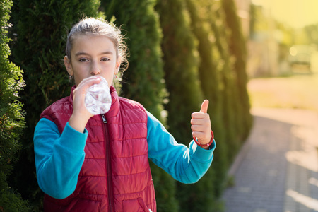 Girl drink waterの写真素材