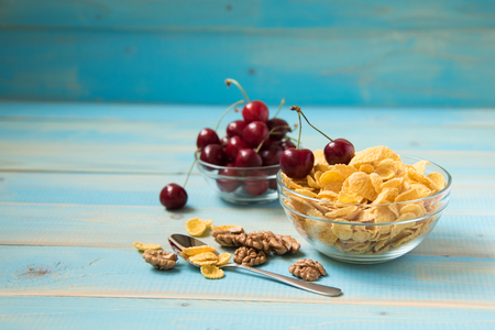 Tasty cornflakes with walnut and cherryの写真素材