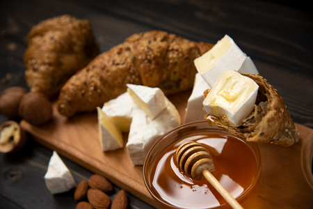 slices of cheese brie or camembert with croissantsの写真素材