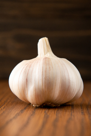 Garlic bulb on wooden vintage backgroundの写真素材
