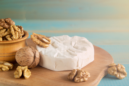 Cheese camembert or brie with walnut kernelsの写真素材