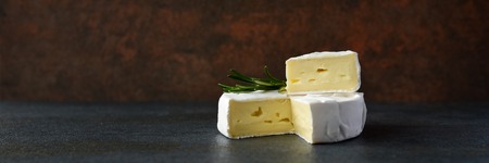 Cheese camembert or brie with fresh rosemaryの写真素材