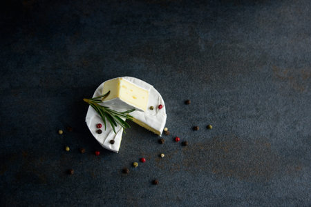 Cheese camembert or brie with fresh rosemaryの写真素材