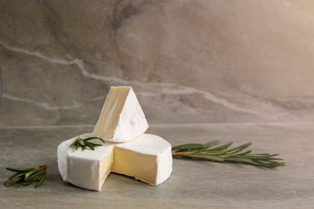 Cheese camembert or brie with fresh rosemary