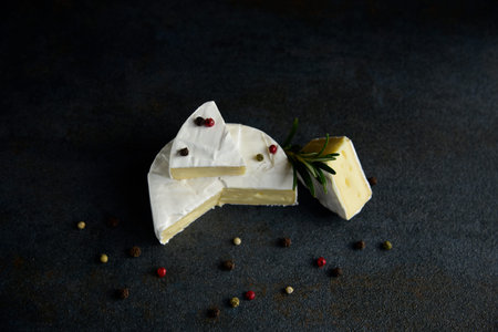 Cheese camembert or brie with fresh rosemary
