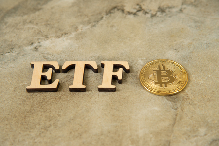 Bitcoin coin with ETF text on stone backgroundの写真素材