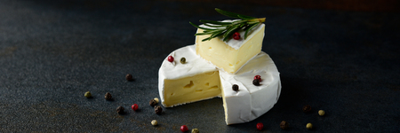 Cheese camembert or brie with fresh rosemaryの写真素材