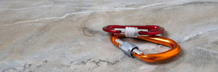 Screw gate carabiners on a marble topの写真素材